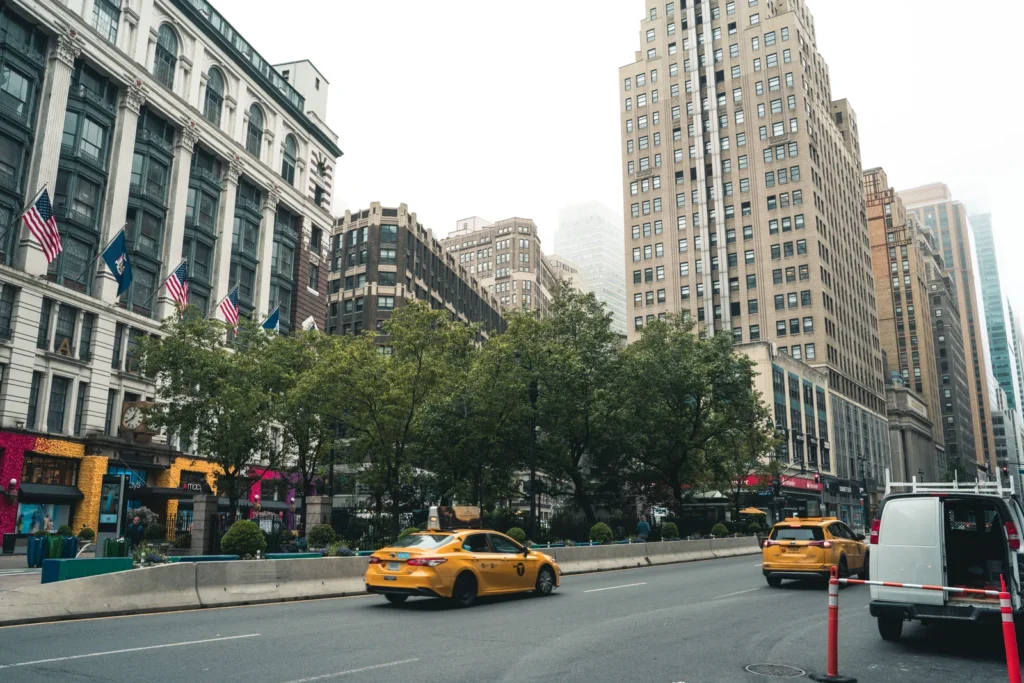 New York City avenue with yellow taxis and traffic